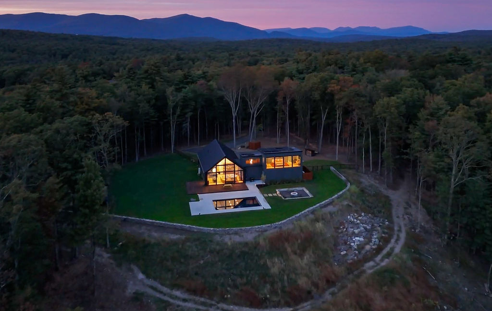 Twilight view of a modern custom home in the Catskills built by Cedar Development Group.